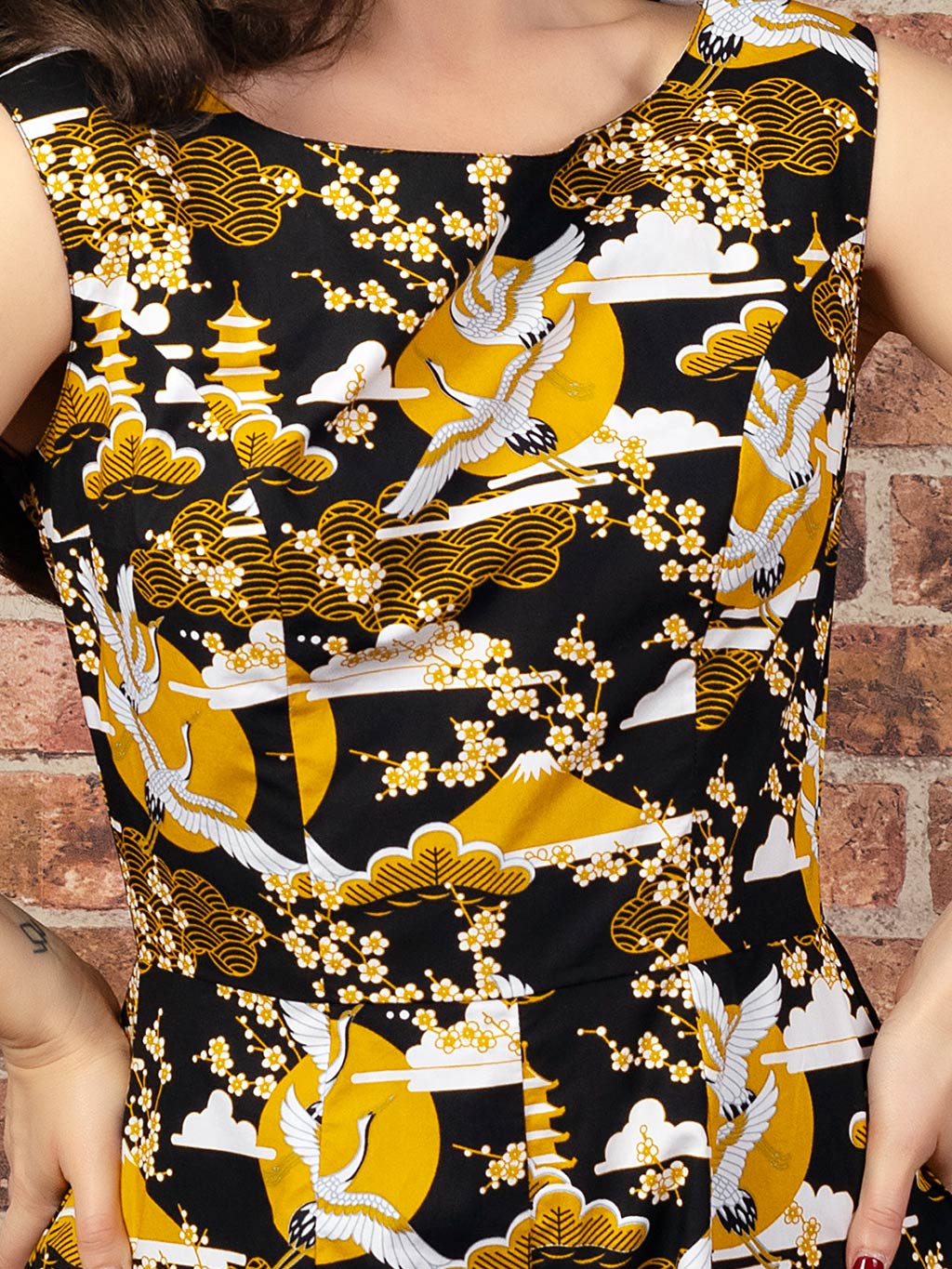 close up of a Japanese crane print fabric in mustard, black and white, used for what katie did&#39;s wide legged jumpsuit