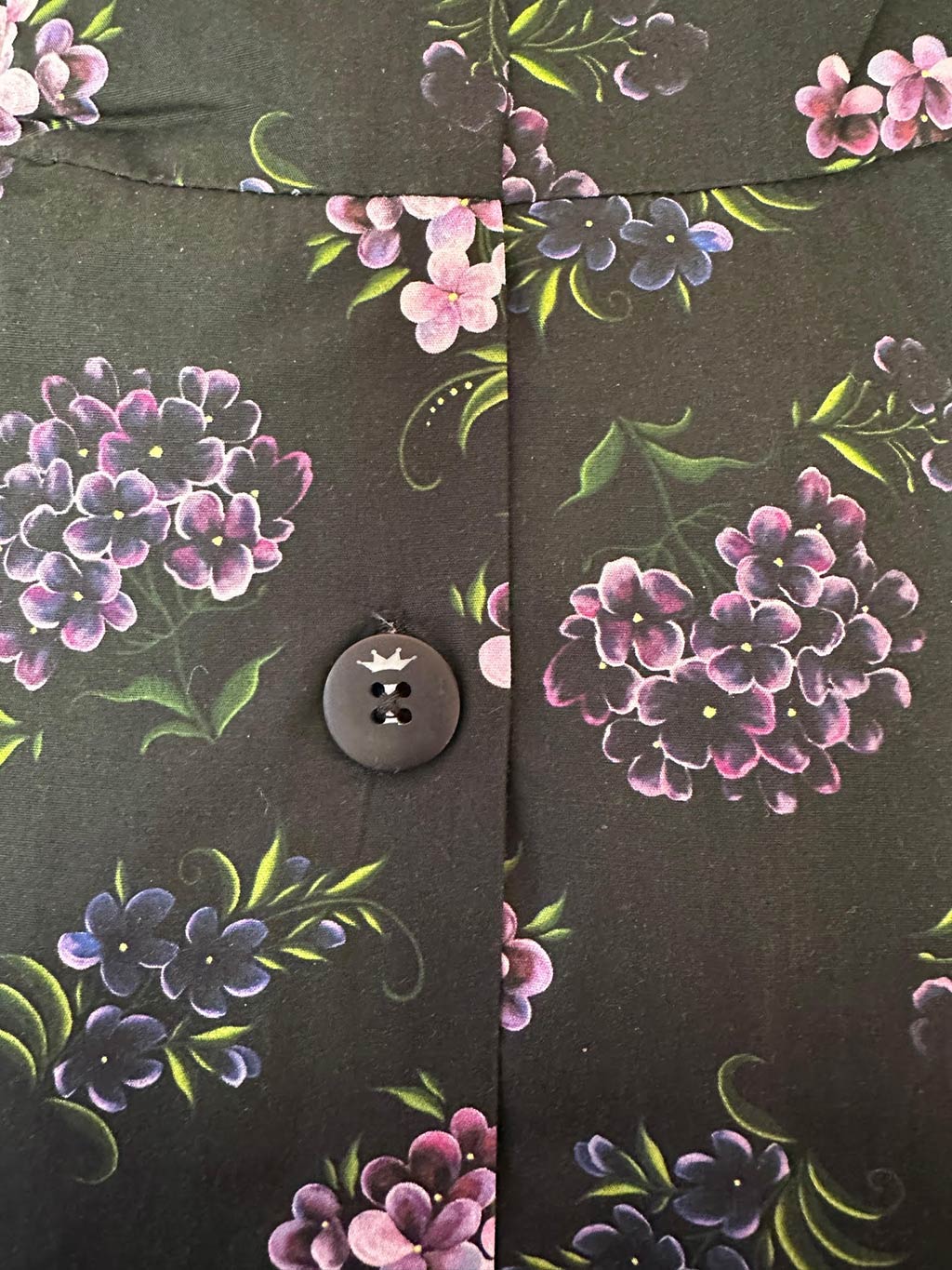 close up of vintage purple floral print fabric