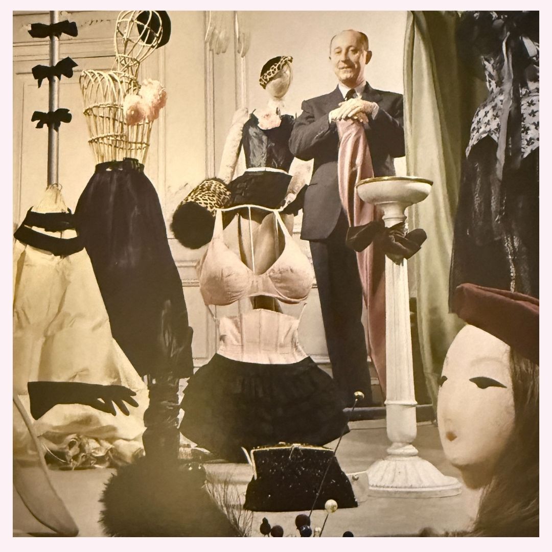 christian dior pictured with his accessories line, including a waist cincher