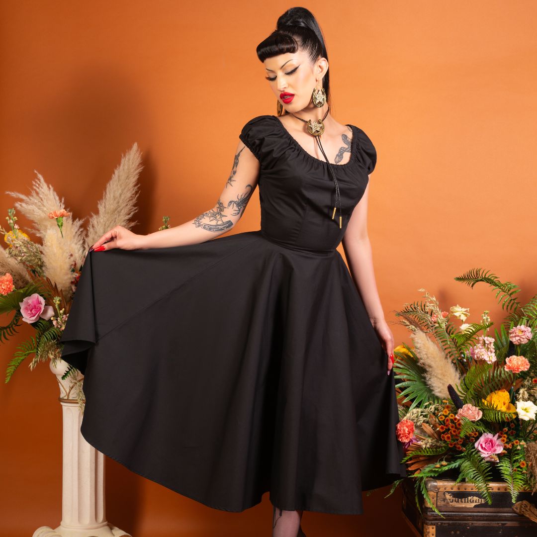 1950s dress with Bardot top which can be worn on or off your shoulders, in black cotton.