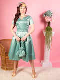 1950s dress  with a box pleated skirt in pastel sage green satin