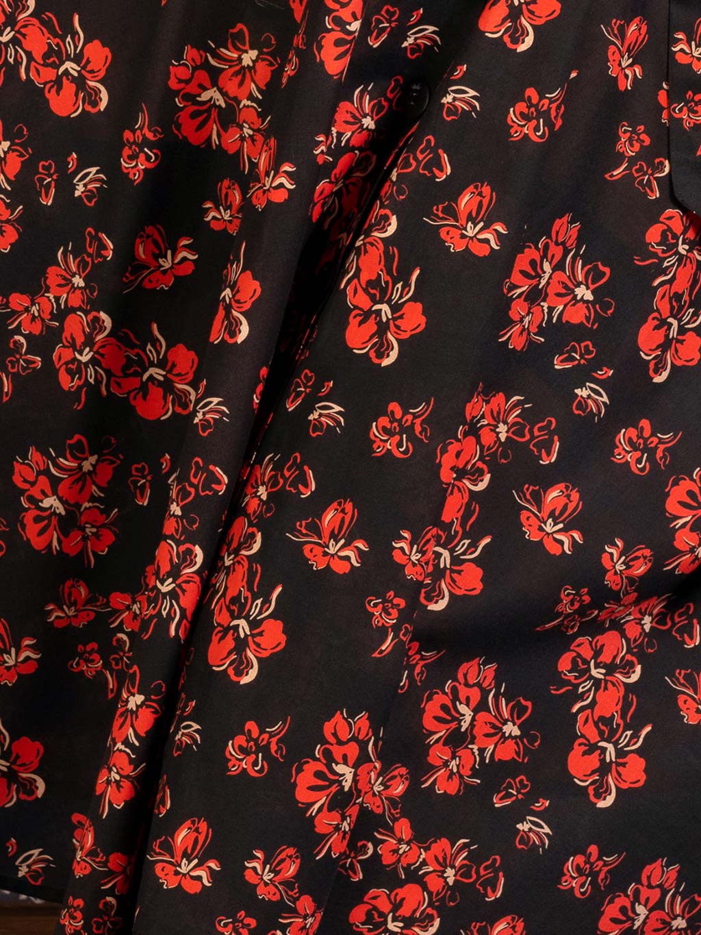 Close up of a 1940s 1950s red, cream and black floral print used in What Katie Did's shirt dress
