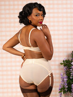 Back view of peach Celia lace suspender belt.