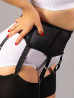 close up of black boned suspender belt worn with retro white lingerie