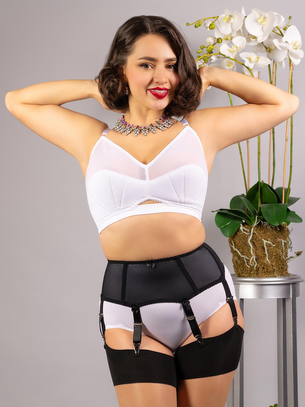 black boned garter belt worn with retro white lingerie