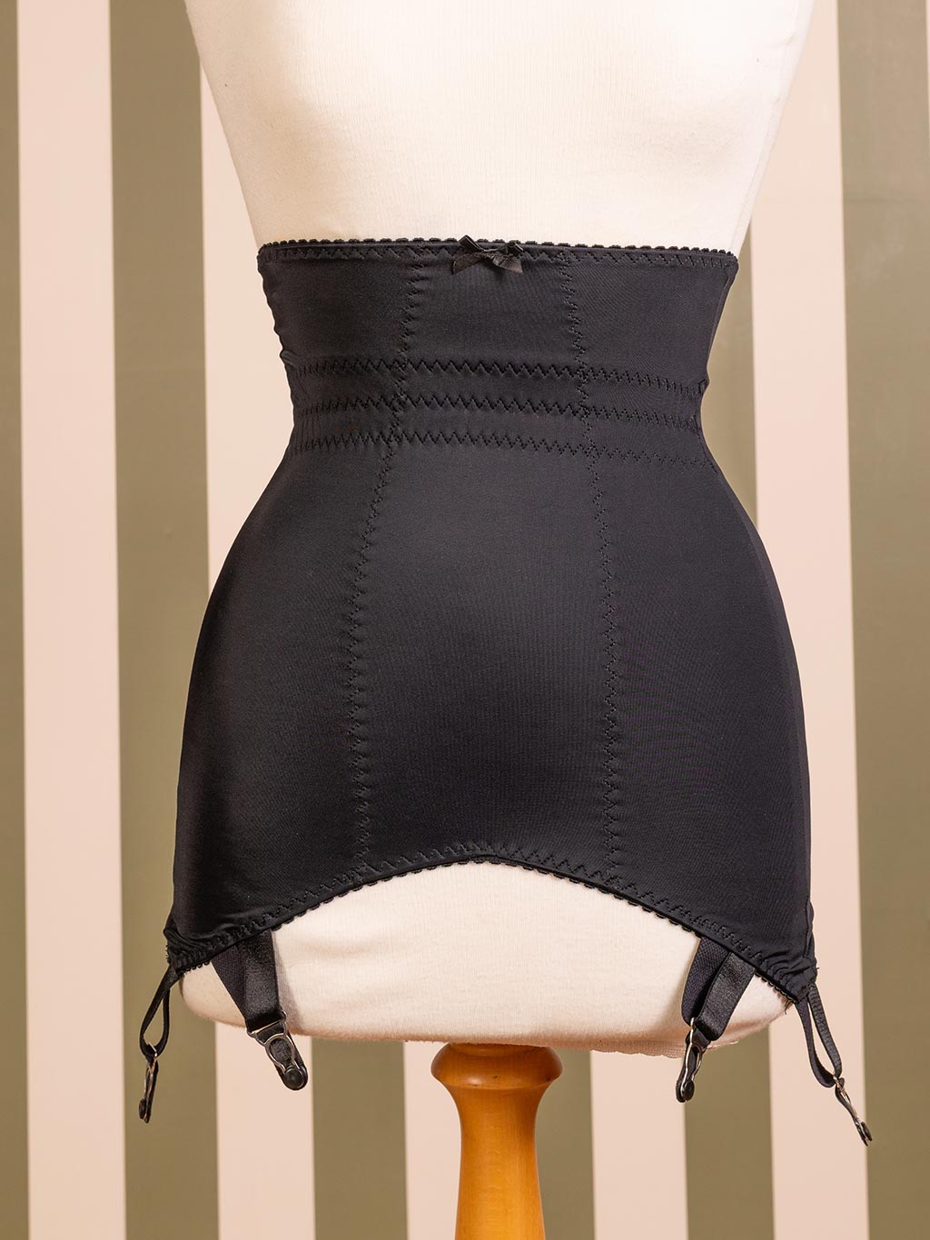 still life of black cincher girdle