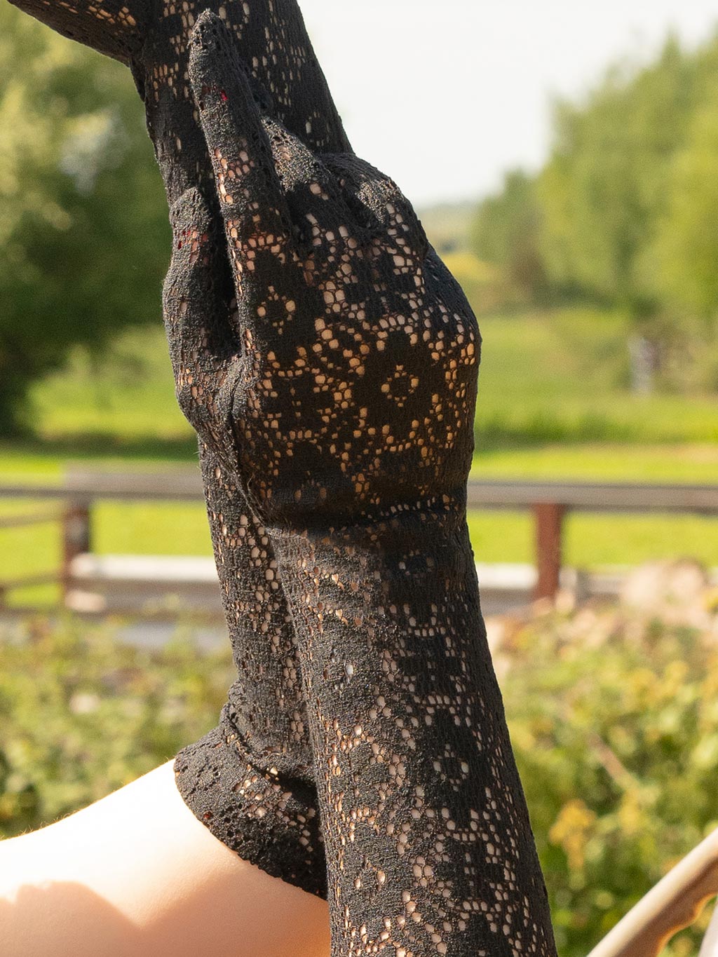 close up of black crochet lace gloves