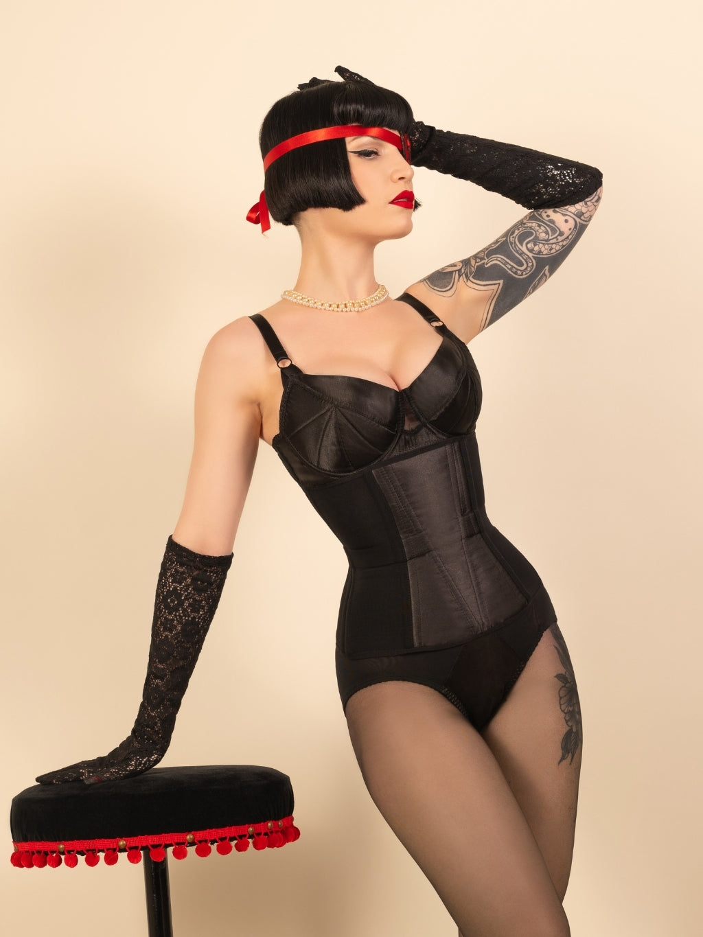 black corset worn with vintage black lingerie and lace gloves