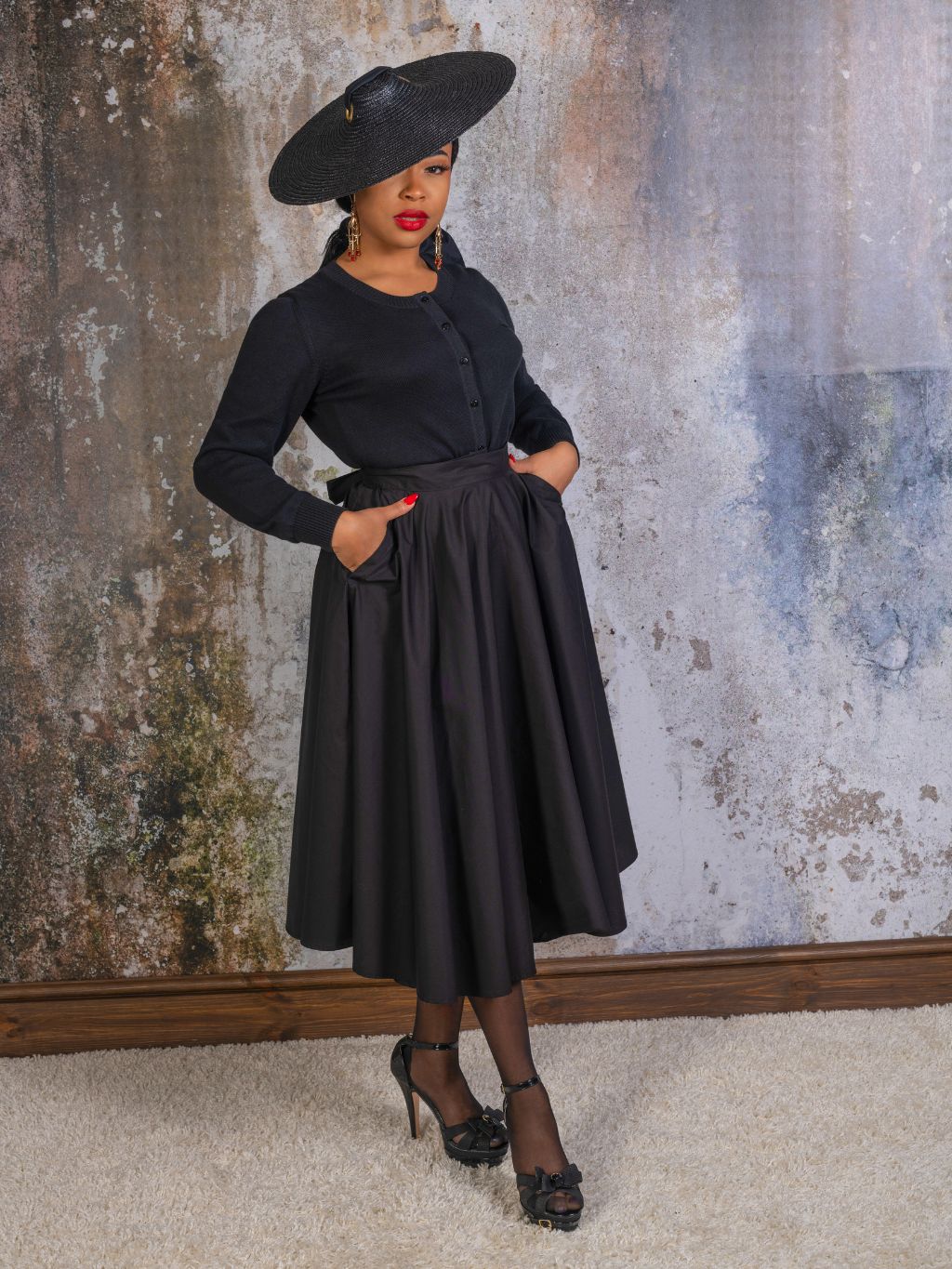 black 1950s black cotton circle skirt worn with wide brimmed straw hat by hood london