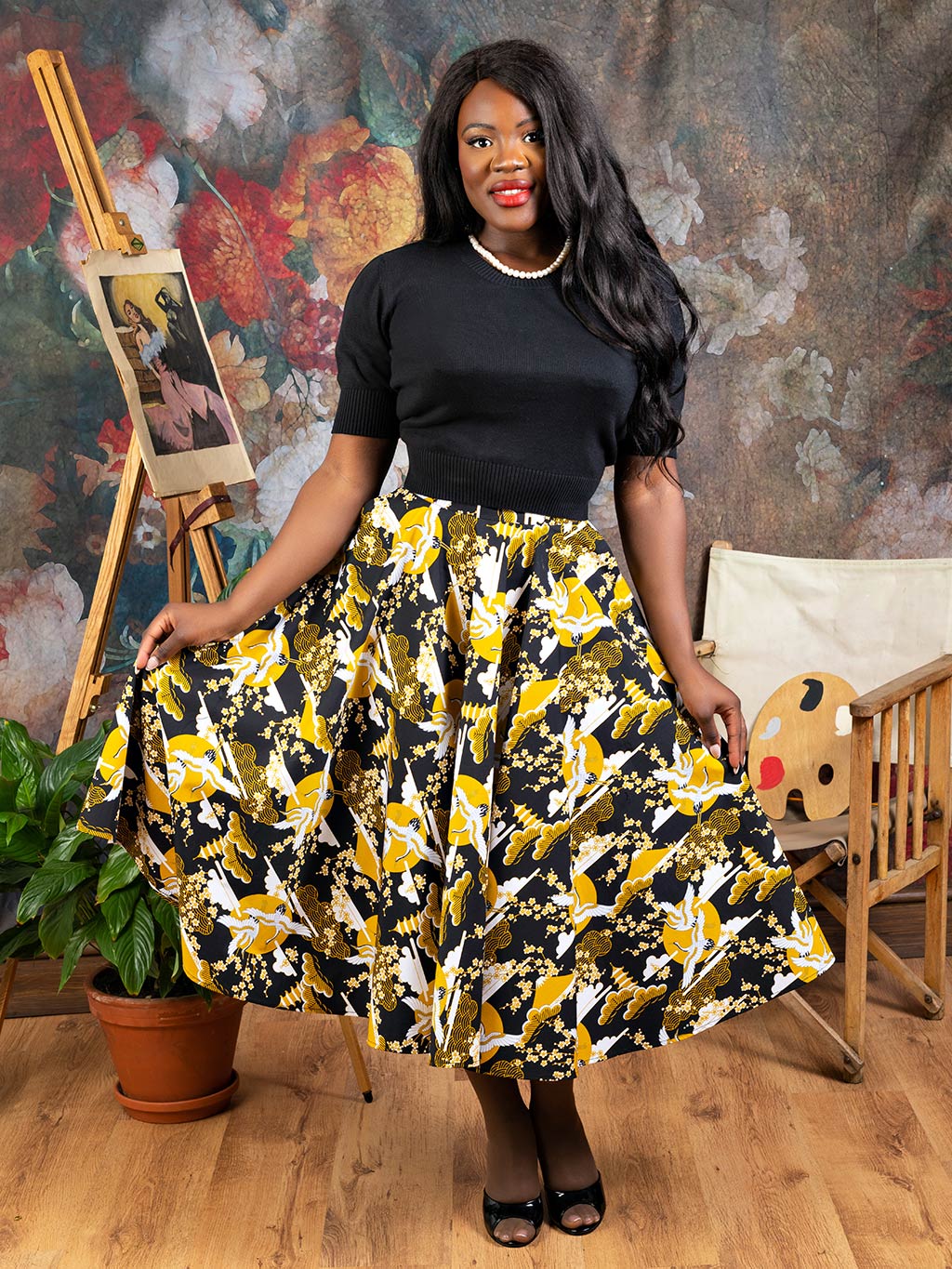 Retro 1950s circle skirt in mustard crane print, with an adjustable waist line, worn with a short sleeve cotton jumper