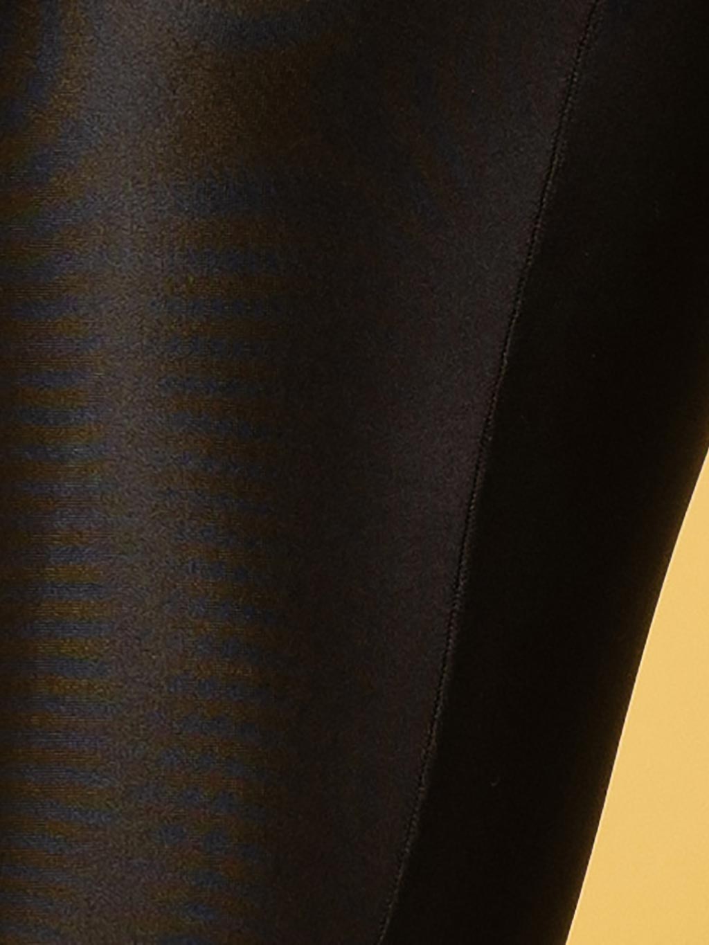 close up of glossy opaque seamed tights