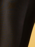 close up of glossy opaque seamed tights
