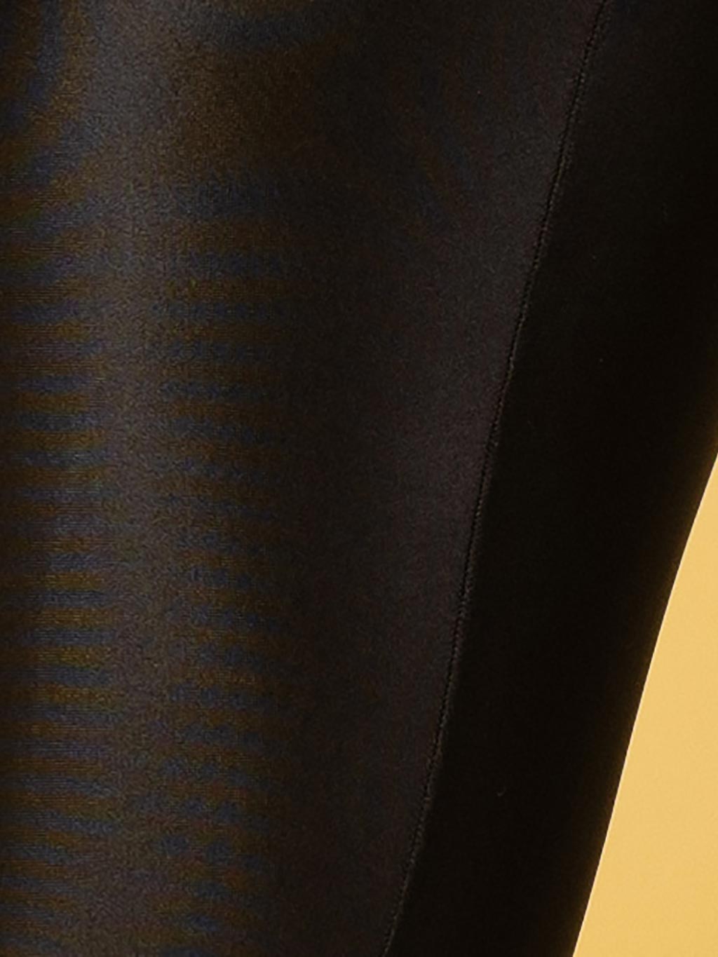close up of glossy opaque seamed tights