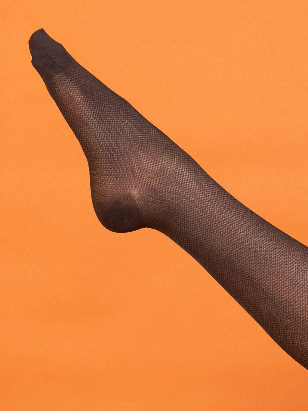 Brown rht tights on an orange background