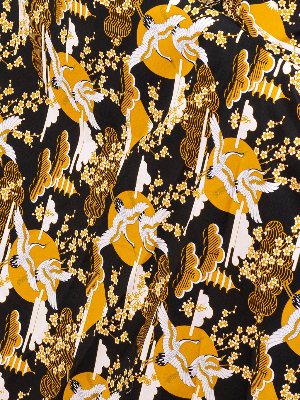 close up of the mustard, cream and black Japanese crane print used in what katie did's thomasina dress