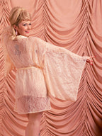 side view of peach vintage lace short kimono robe worn over matching camiknicker