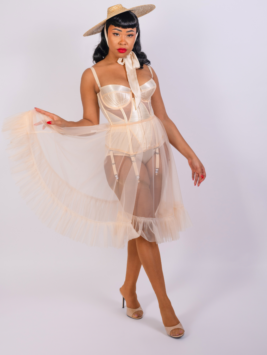 sheer nylon frilly petticoat in vintage peach nylon worn with matching 1950s lingerie and seamed stockings