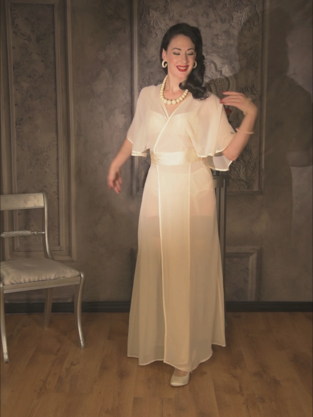 1930s style showgirl dancing in our sheer peach robe with a neat bow at the back.