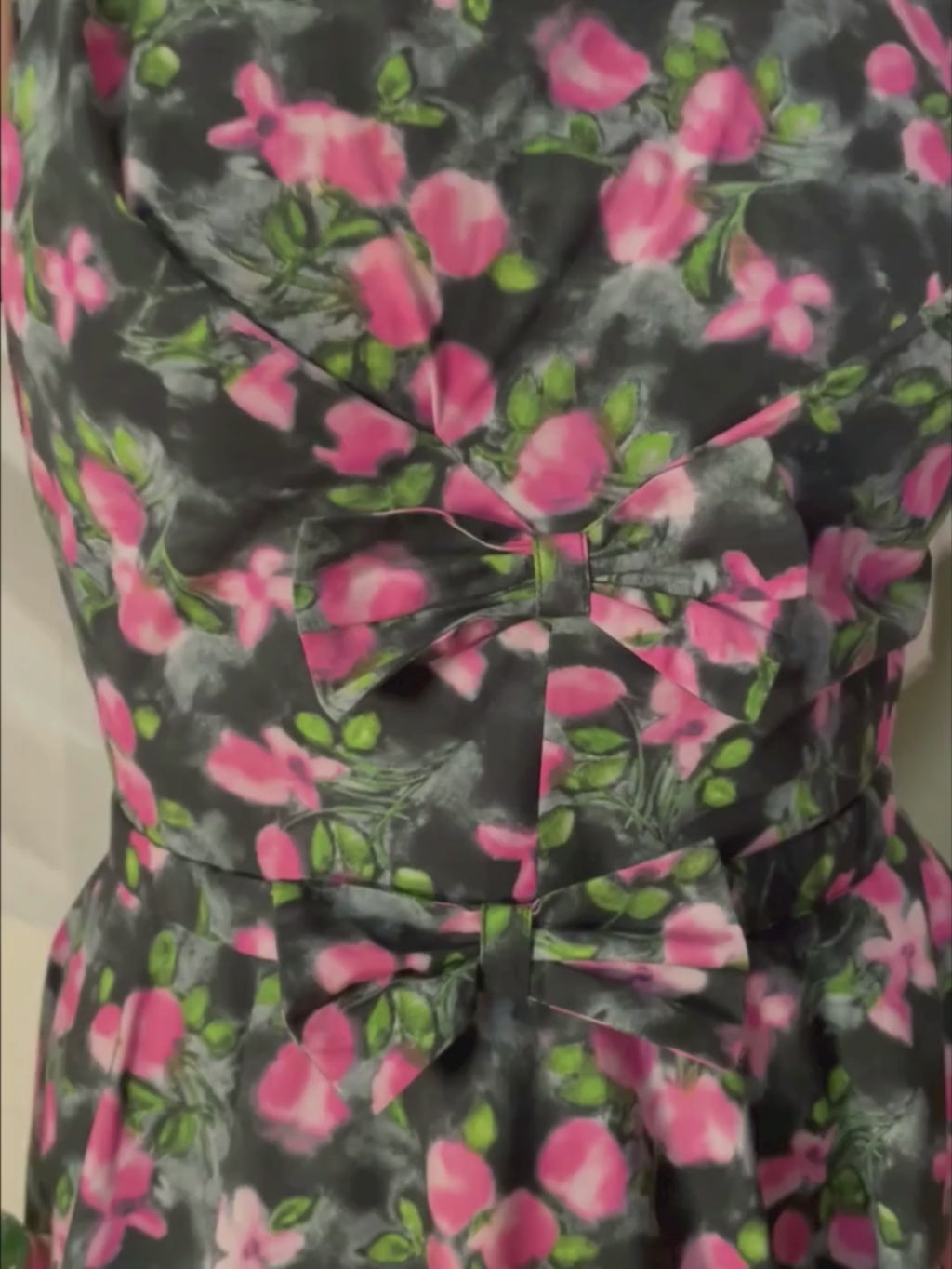 Wilhelmina 1950s-inspired grey floral dress with bow detail on our redheaded model - perfect vintage silhouette