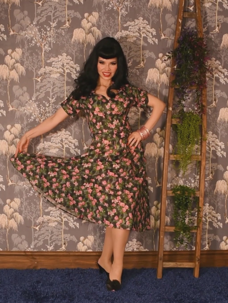 1940s floral print dress in grey with pink flowers and a touch of green