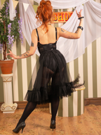 1950s black frilly nylon petticoat worn with black stockings and vintage blue lingerie