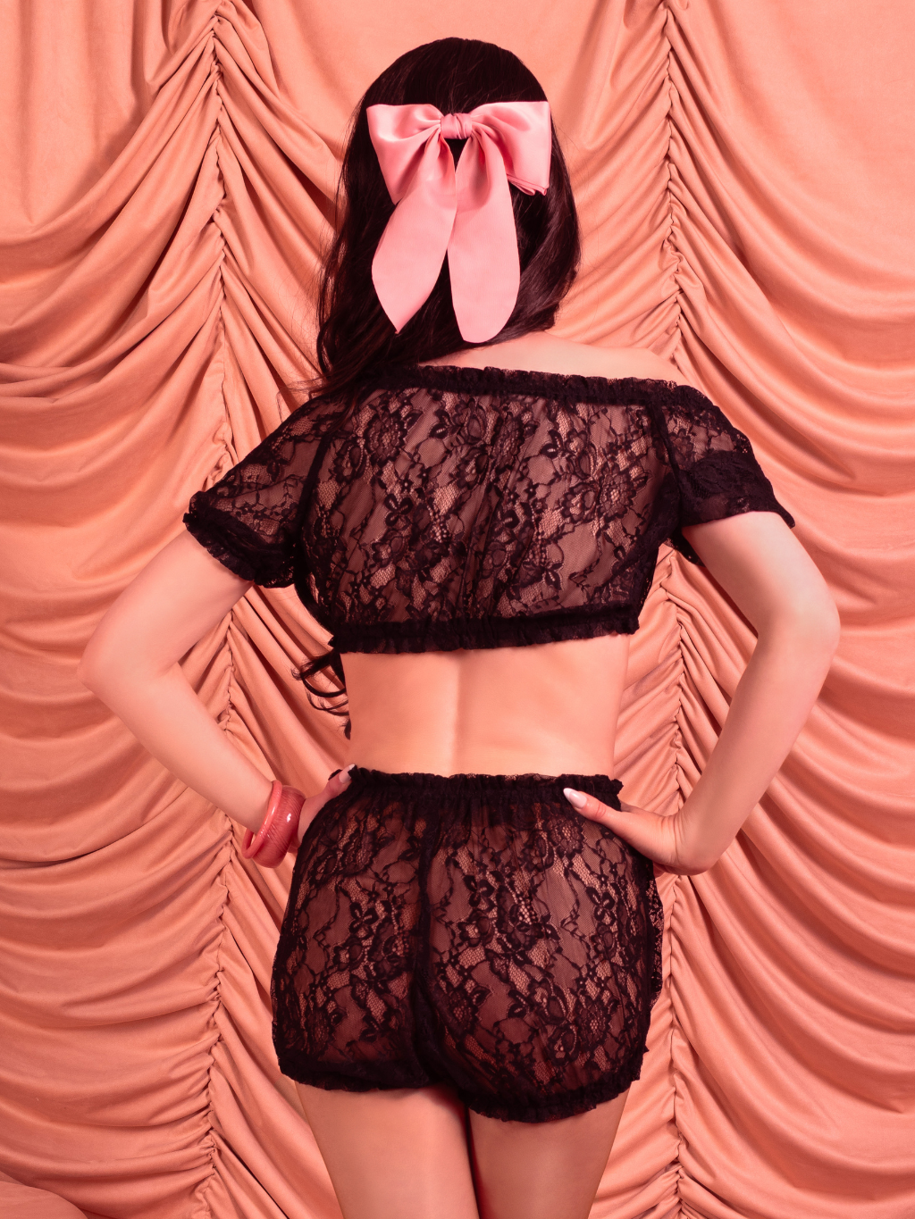 Model walking and twirling in Priscilla Black Lace Bloomers and matching Babydoll Top, showing off sheer lace fabric and flowing silhouette