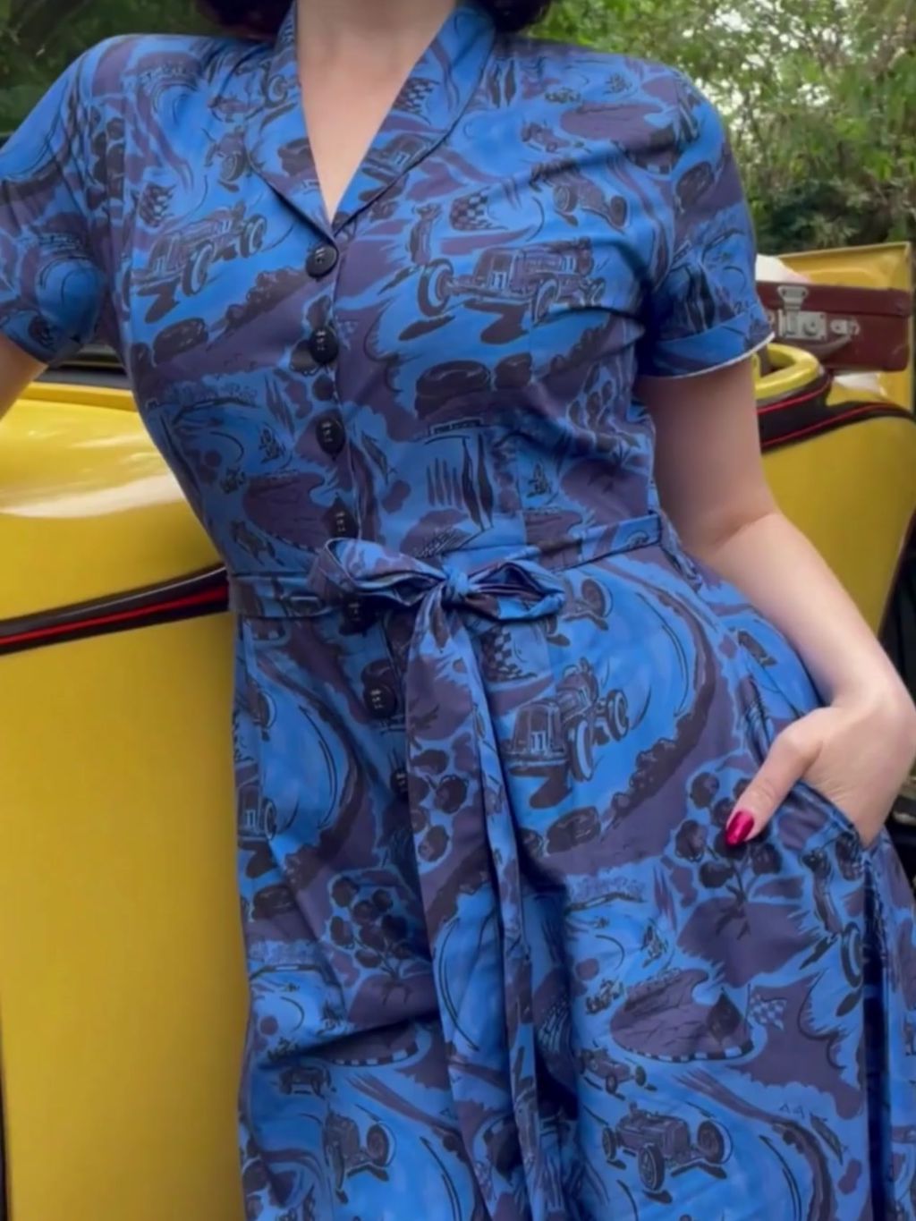 video of a model wearing vintage blue beach pyjamas with a racing car print