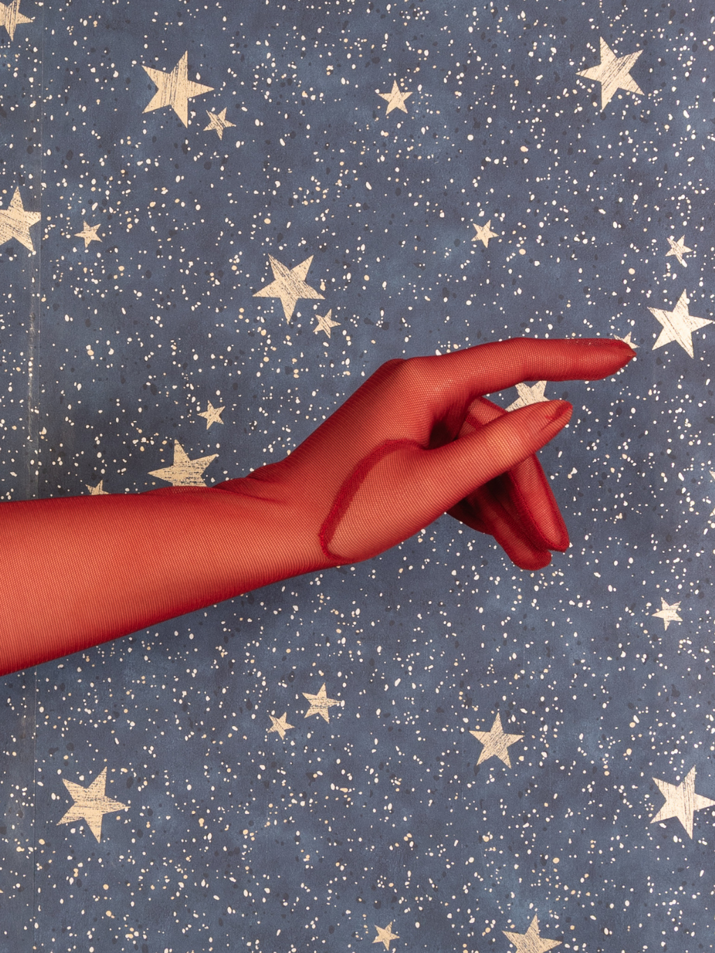 Woman wearing  red gloves.