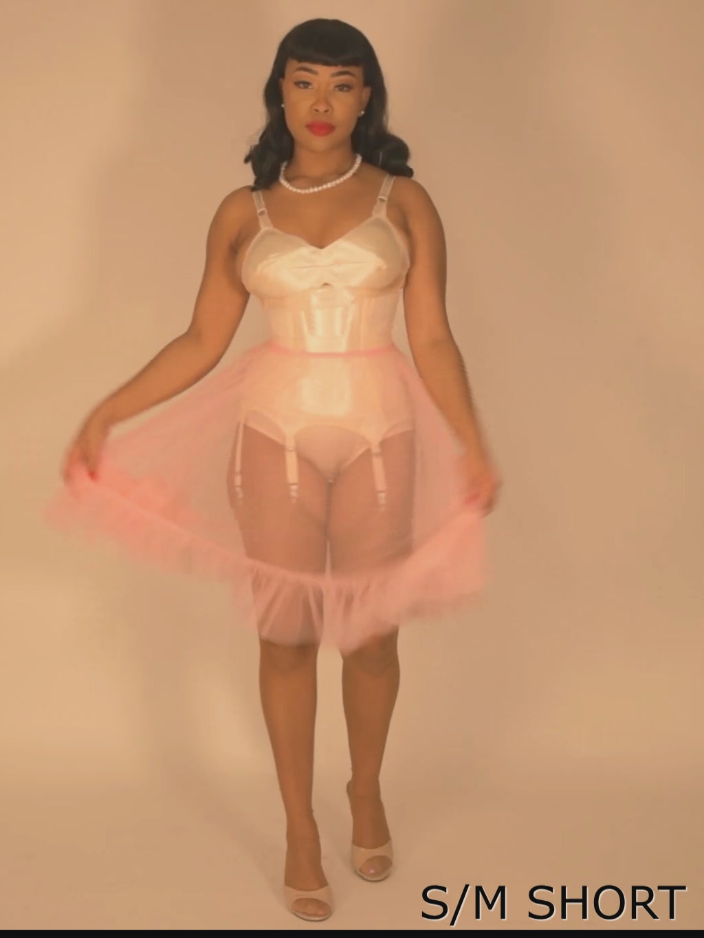 Vintage sheer pink petticoat worn with matching pink seamed stockings and vintage merry widow basque.Vintage sheer pink petticoat