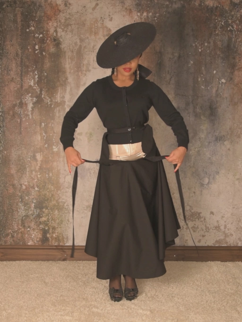 black 1950s black cotton circle skirt worn with black seamed stockings