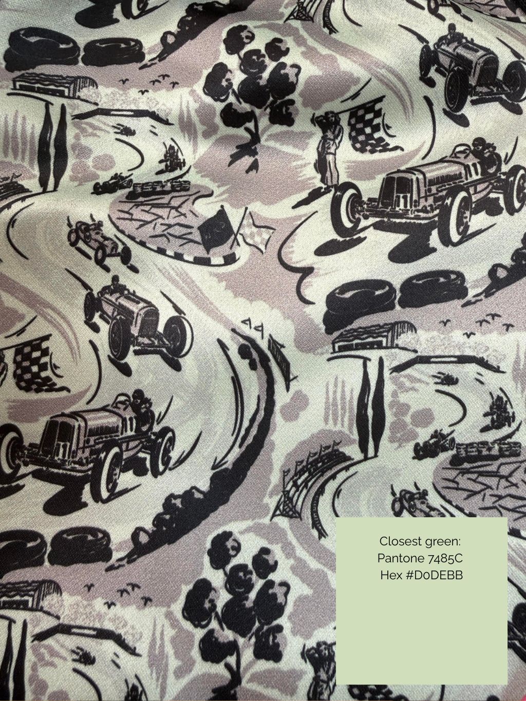 vintage motor racing scene in green and black printed on duchess satin