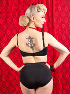 retro black high waist knickers worn with matching soft cup bra