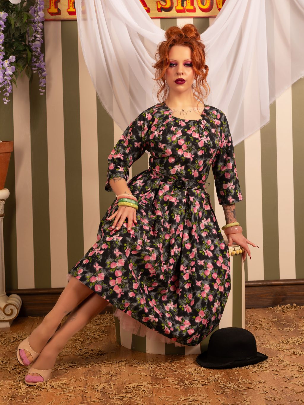 1950s dress with sleeves in grey, pink and green floral print. 