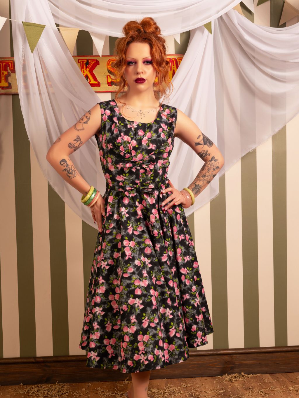front view of Wilhelmina 1950s-inspired grey floral dress with bow detail on our redheaded model - perfect vintage silhouette