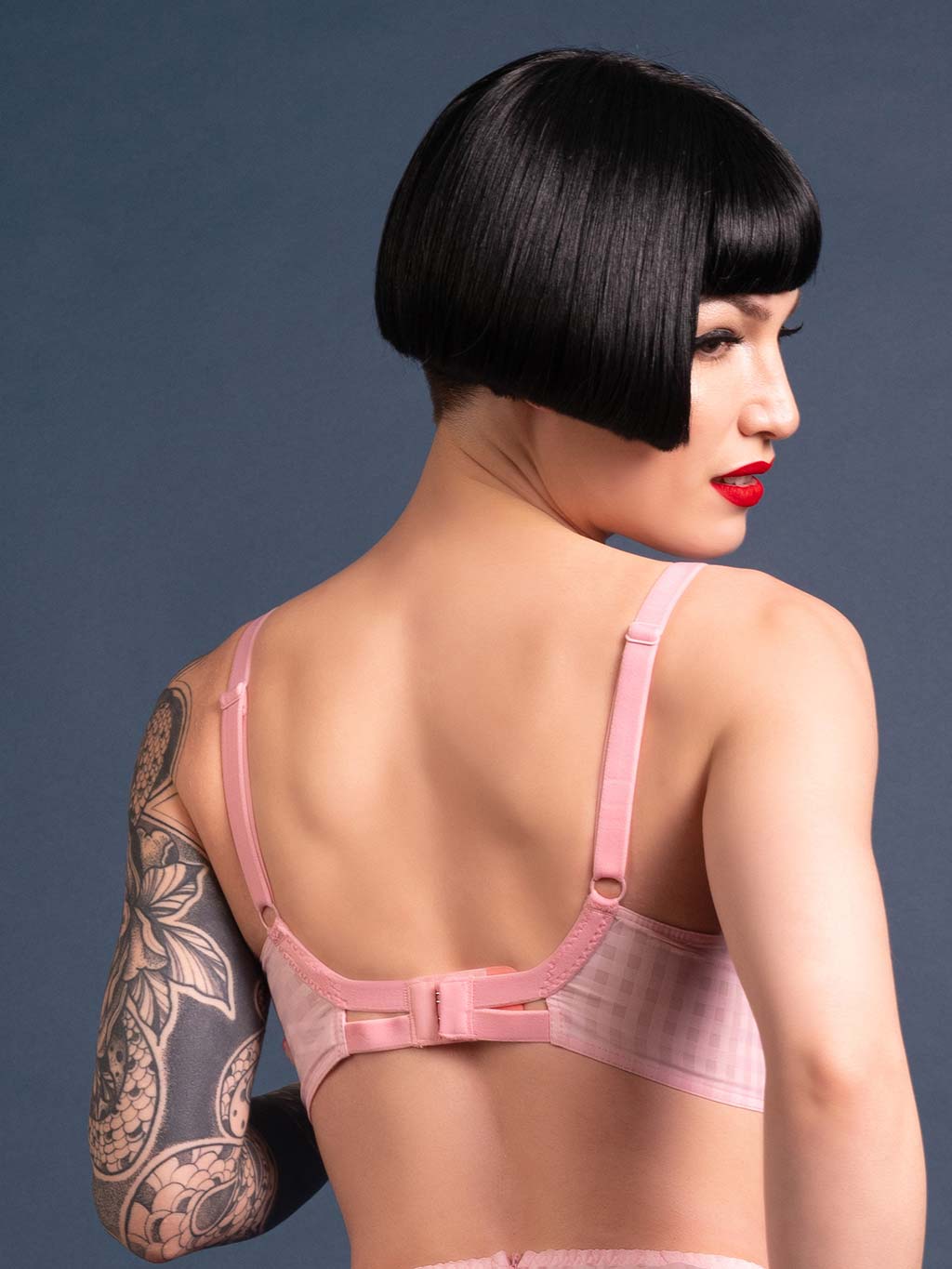 back view of a 1950s pink gingham bullet bra