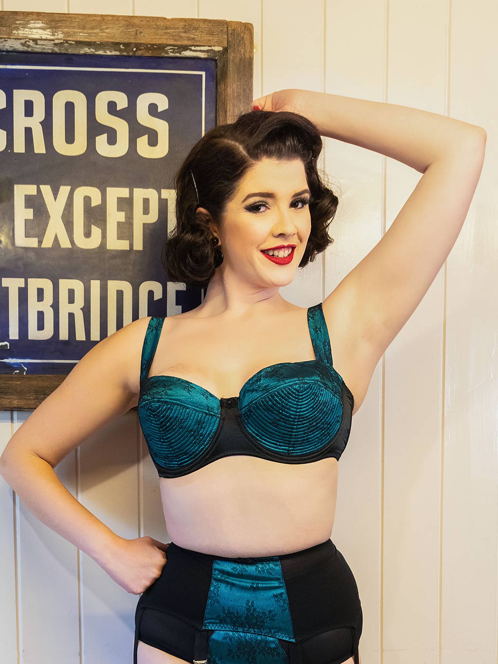 1950s inspired balconette bra in teal and black.  Intricate vintage stitching detail on cup.  Shop vintage inspired lingerie at What Katie Did
