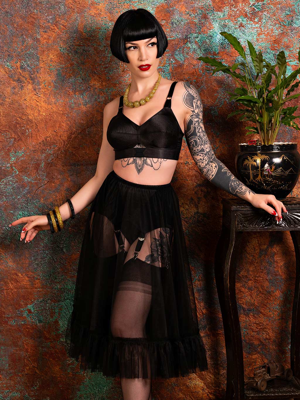 black frilly petticoat in 100% nylon, worn with 1950s satin bullet bra and black stockings