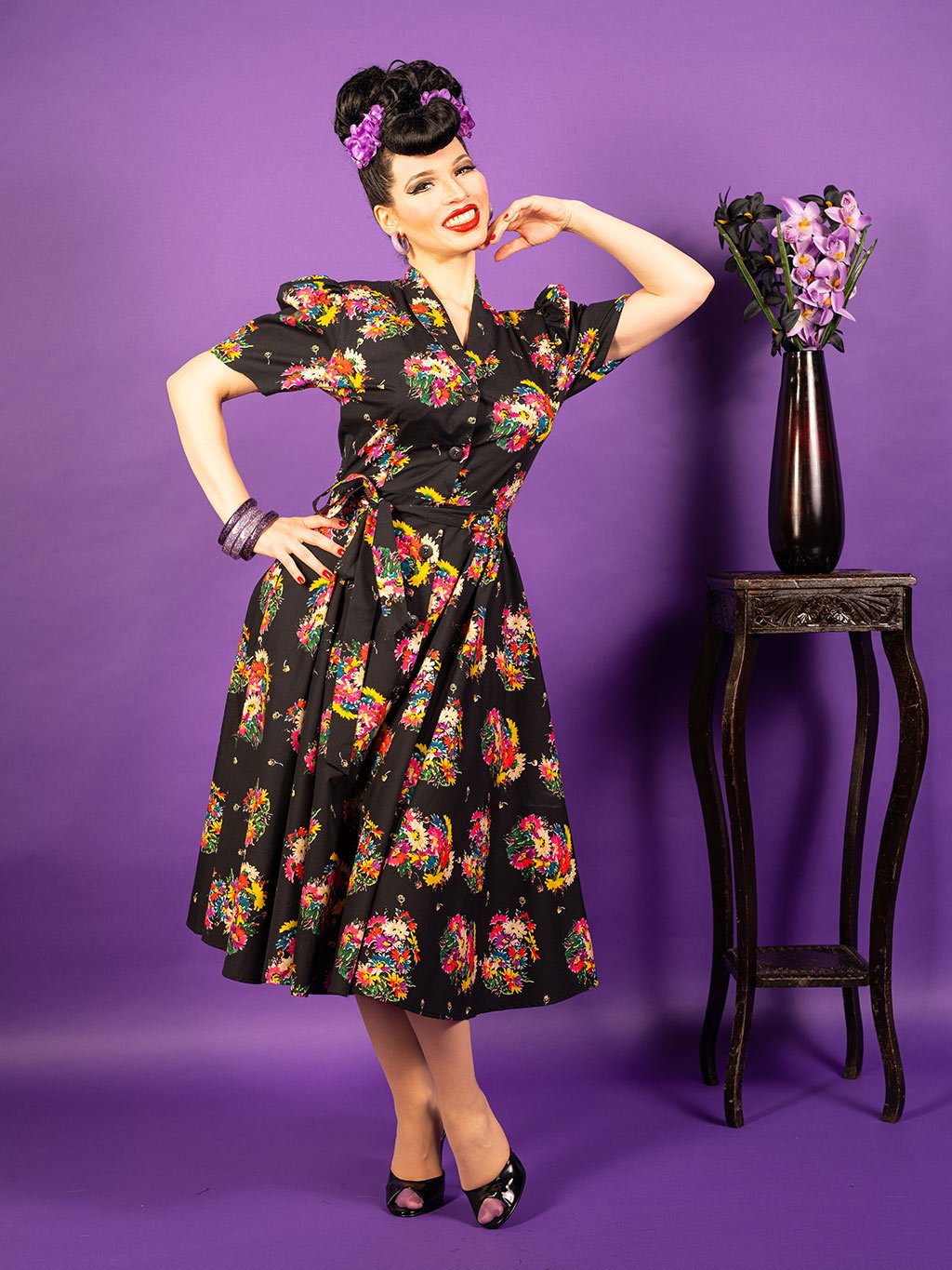1950s floral dress.  Retro black cotton shirtwaist dress with floral print.  Fitted top with full skirt falling just below the knee.