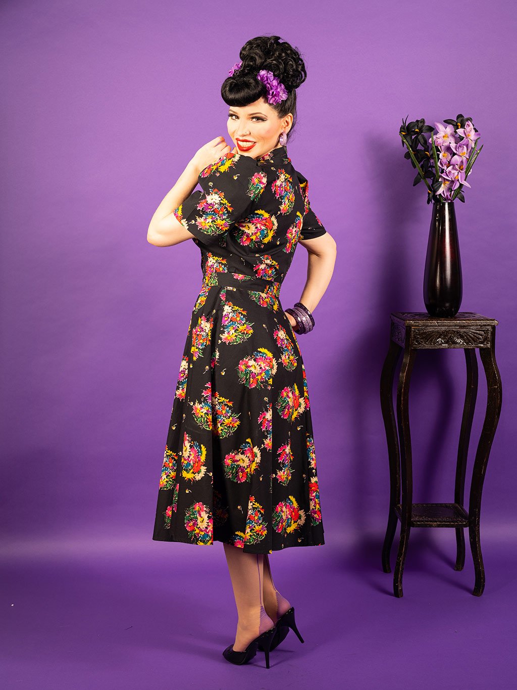 1950s black floral dress.  Retro cotton shirt dress with floral print.  Fitted shirt style top with full skirt falling just below the knee.