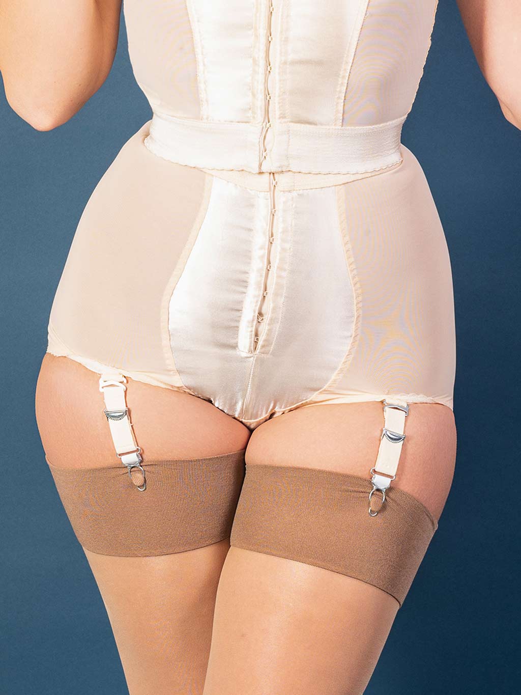 1950s inspired panty girdle.  Made from satin and strong powermesh with wide elastic to cinch your waist.  Detachable suspender/garter straps so can be worn with or without stockings.