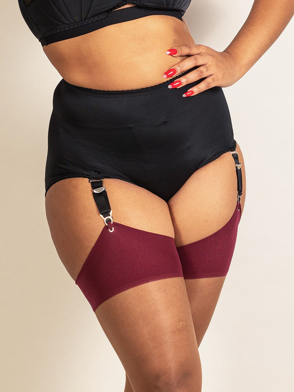Retro black suspender knickers by What Katie Did. Made from a matte stretch recycled fabric with 4 detachable suspender straps so they can be worn with or without stockings.