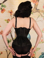 back view of a curvy black satin underbust corset