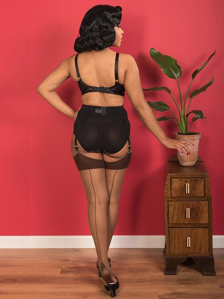 1950s inspired seamed stockings, 15 denier, made from 100% nylon.  Nutmeg seamed stocings with nutmeg coloured sheer leg which is ideal for darker skin tones and coordinating nutmeg brown seam welt and foot