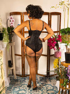 steel boned corset worn with chocolate brown fully fashioned stockings and 1950s style black satin lingerie by what katie did